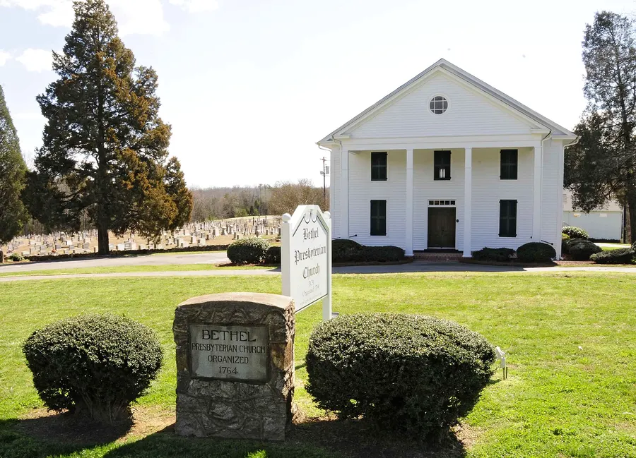 White-columned Bethel Presbyterian Church and its stone marker near Clover, SC