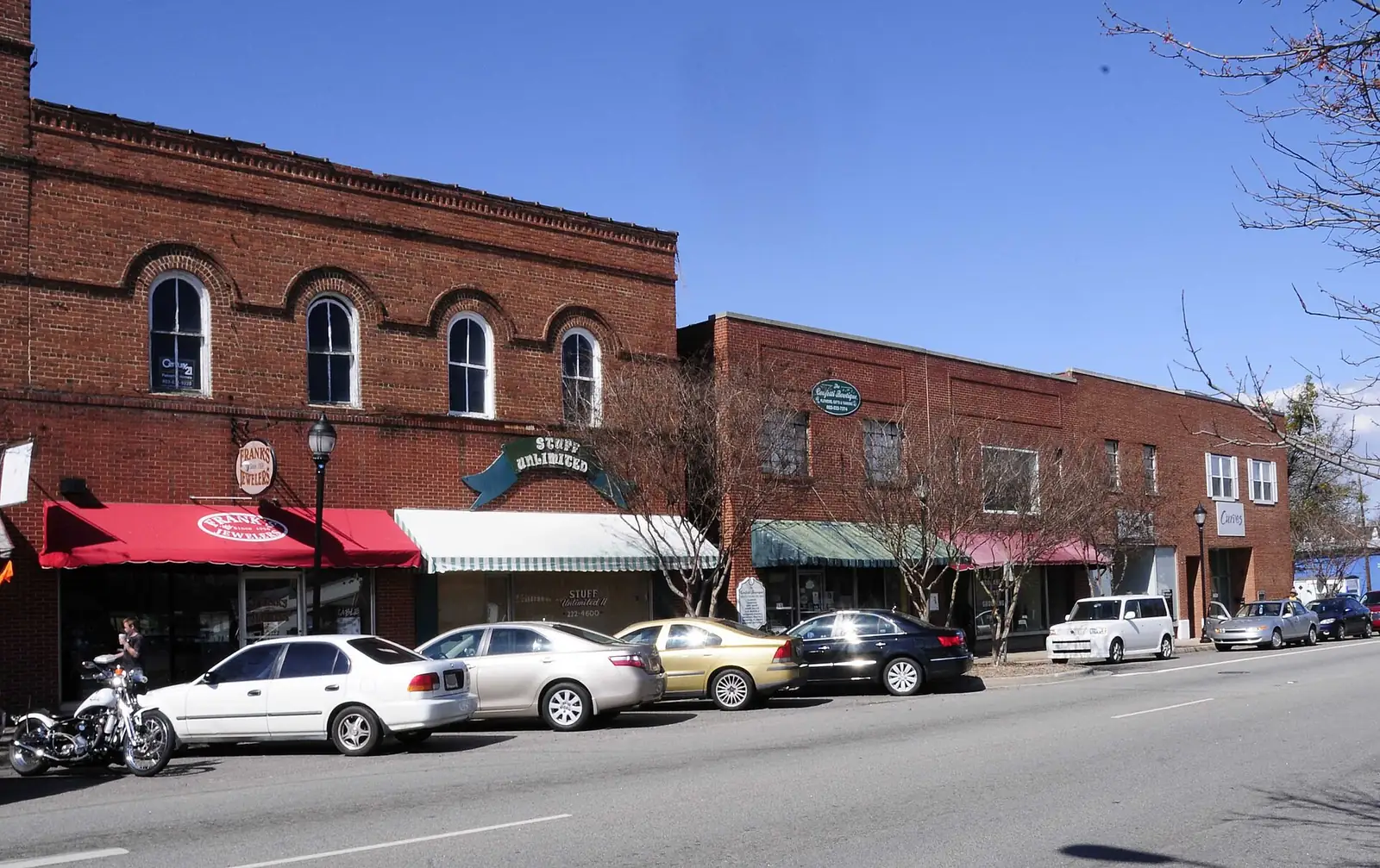 Two-story brick storefronts with awnings in downtown Clover, SC